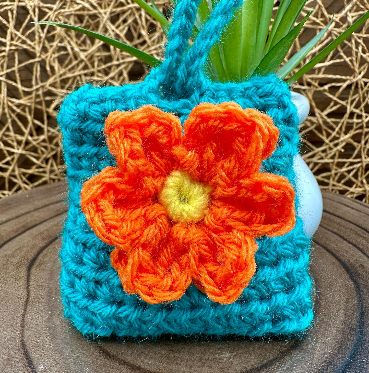 Blue Crocheted Wireless earbud case, compatible with AirPods, measures 3 T 3 H .25 D, Pretty Raised Orange Flower Granny Square Design