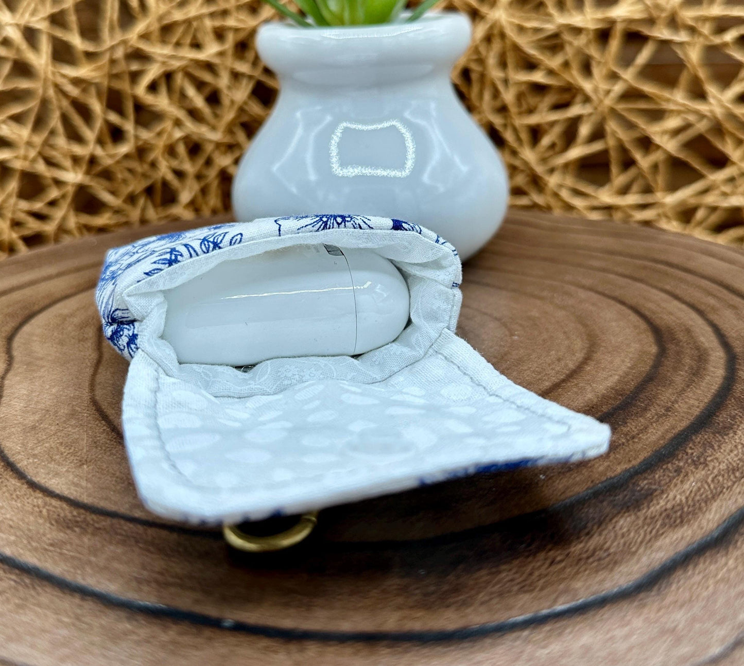 Wireless earbud case, Elegant Navy Floral fabric with snap closure and swivel clasp for added protection and convenience, 3X3X.75"