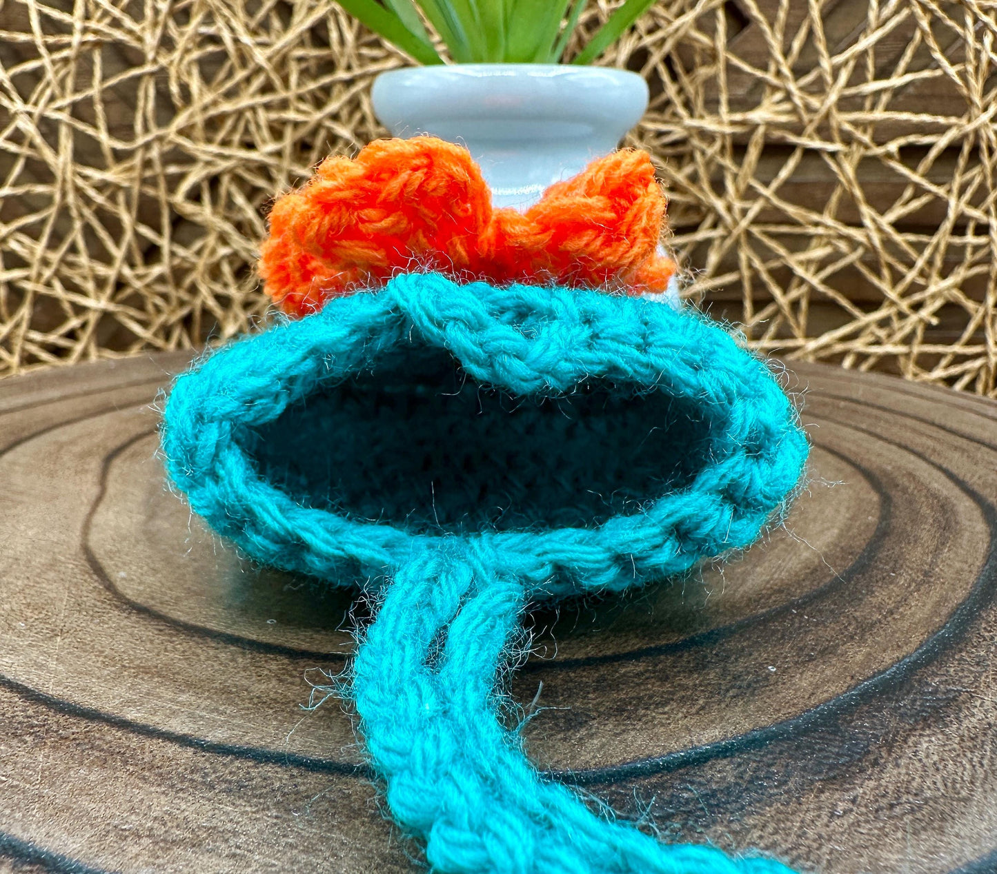 Blue Crocheted Wireless earbud case, compatible with AirPods, measures 3 T 3 H .25 D, Pretty Raised Orange Flower Granny Square Design