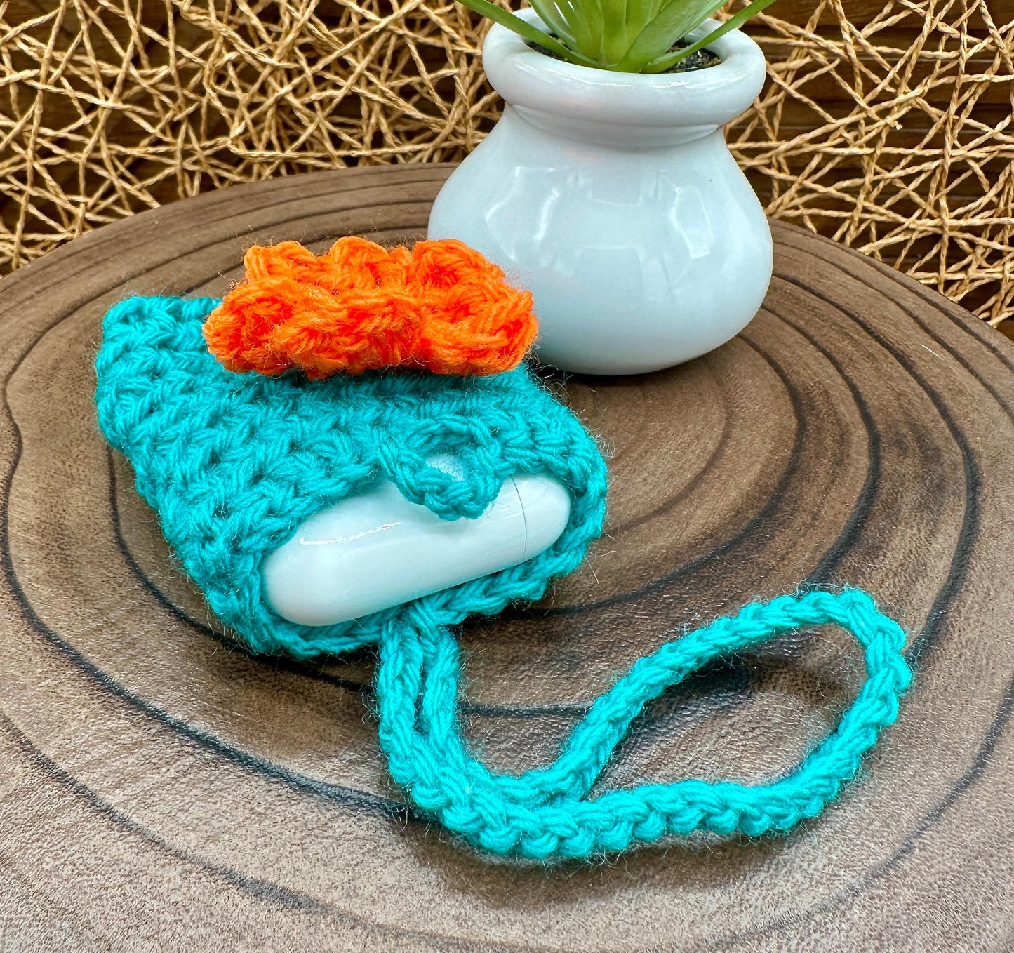 Blue Crocheted Wireless earbud case, compatible with AirPods, measures 3 T 3 H .25 D, Pretty Raised Orange Flower Granny Square Design