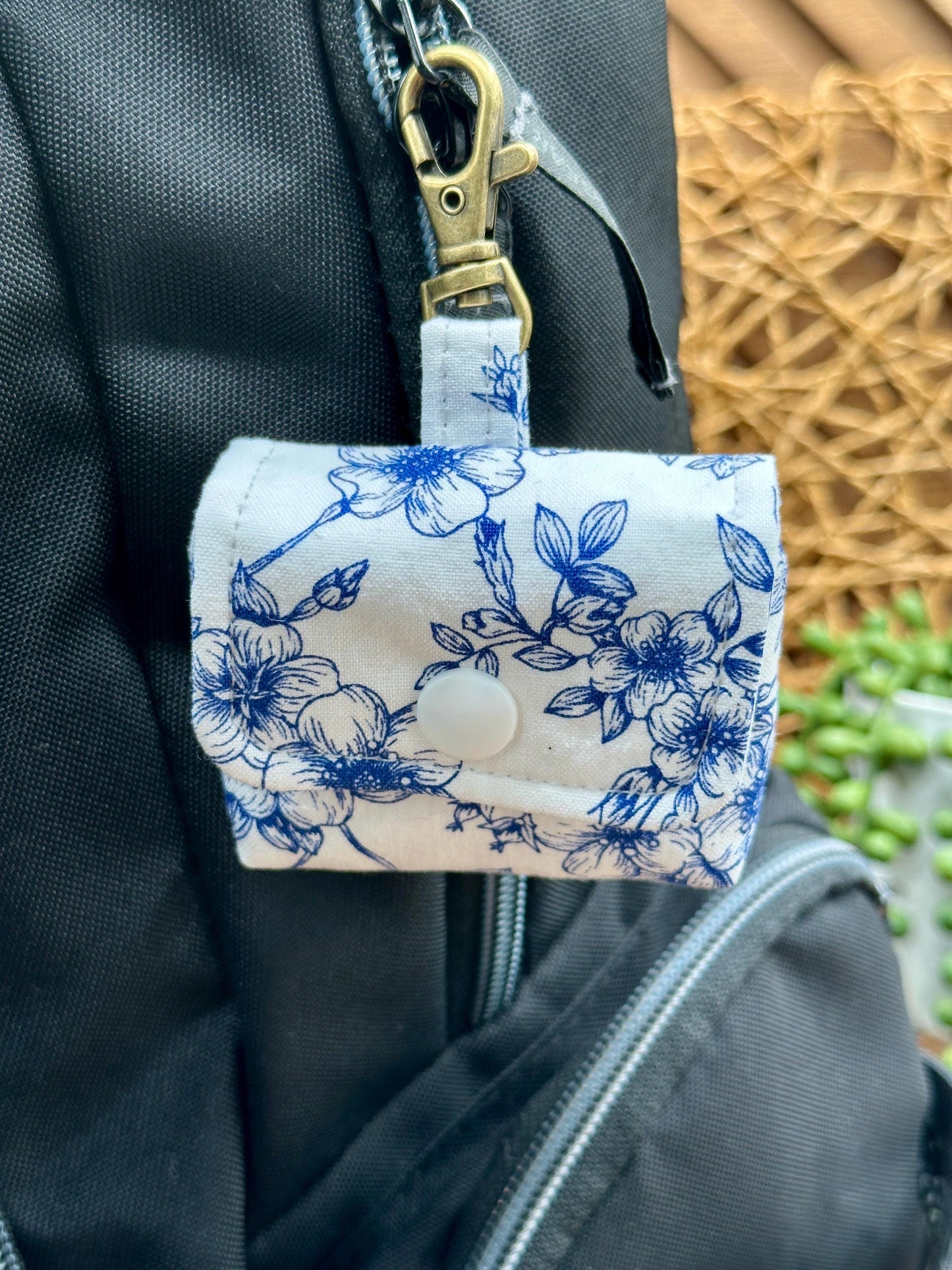 Wireless earbud case, Elegant Navy Floral fabric with snap closure and swivel clasp for added protection and convenience, 3X3X.75"