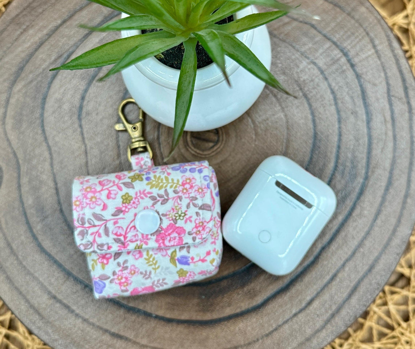 Wireless earbud case, Dainty Lilac and Pink floral fabric with snap closure and swivel clasp for added protection and convenience, 3X3X.75"