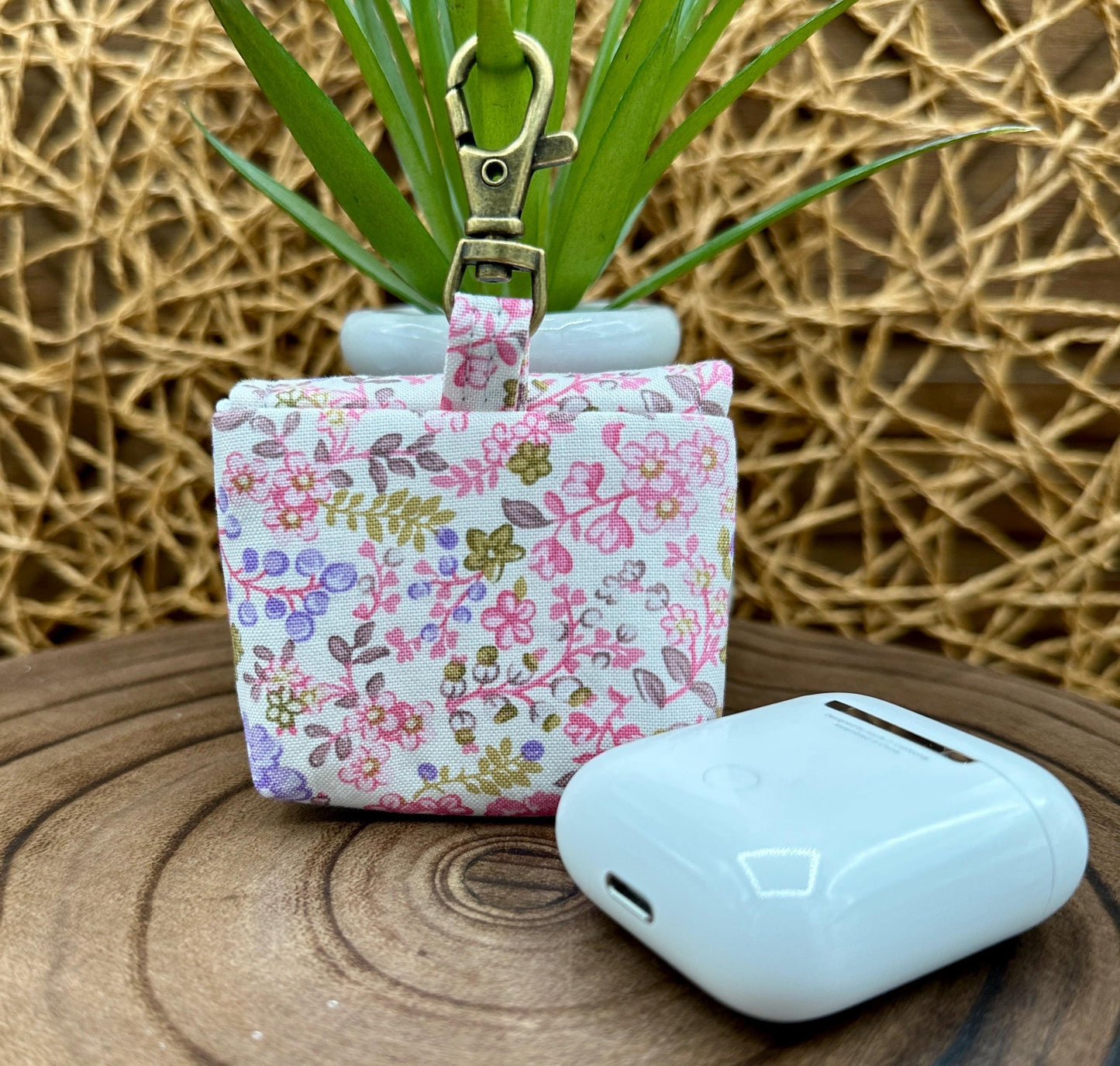 Wireless earbud case, Dainty Lilac and Pink floral fabric with snap closure and swivel clasp for added protection and convenience, 3X3X.75"