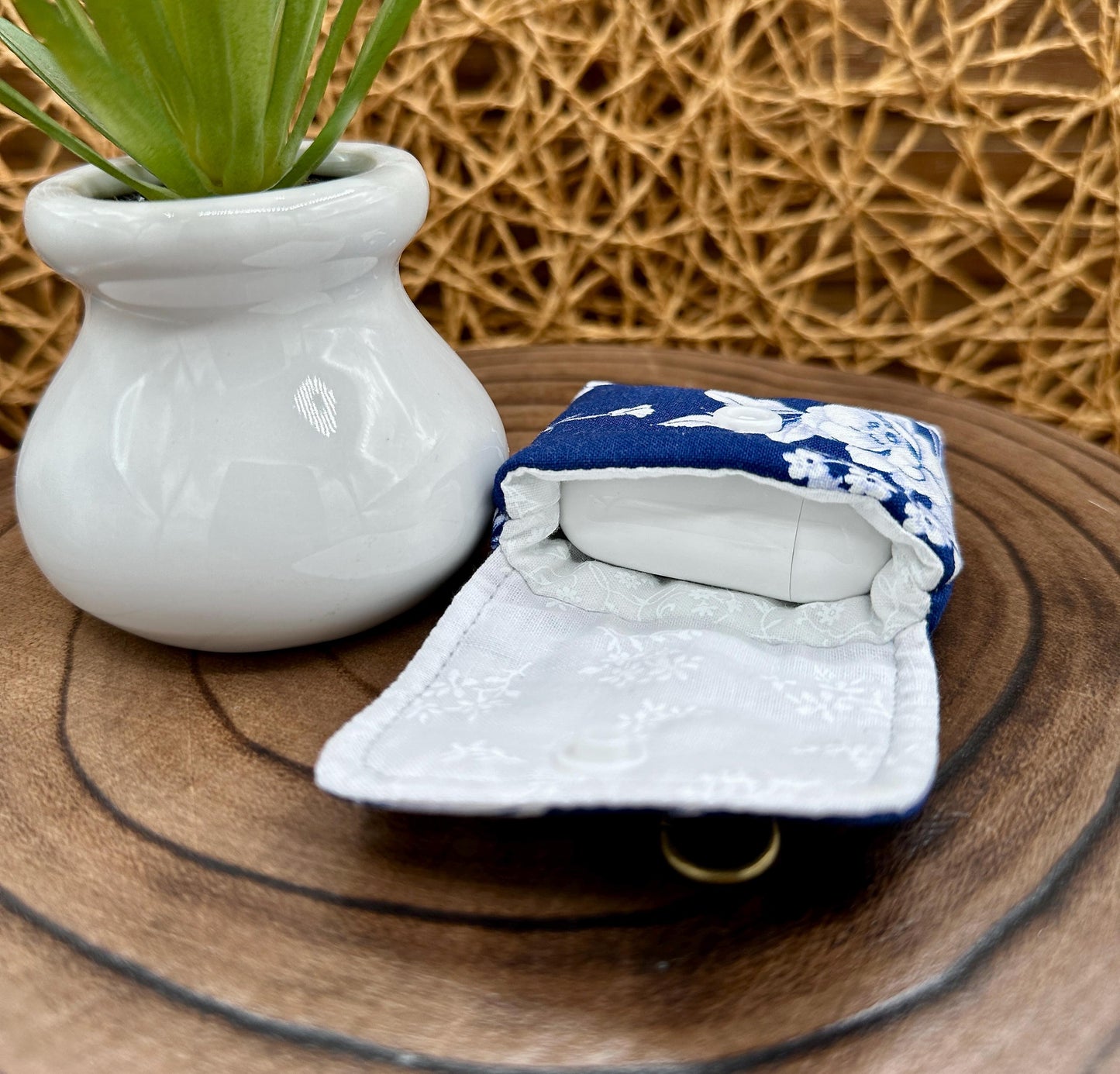 Wireless earbud case, Elegant Navy fabric with White flowers with snap closure and swivel clasp for protection and convenience, 3X3X.75"