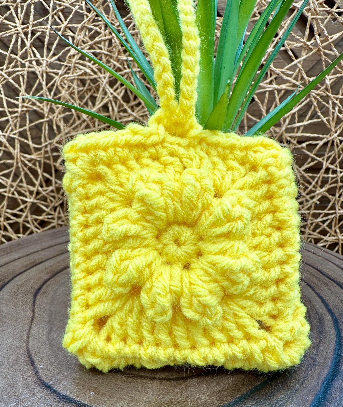 Yellow Crocheted Wireless earbud case, compatible with AirPods, measures 3 T 3 H .25 D, Pretty Raised Flower Granny Square Design