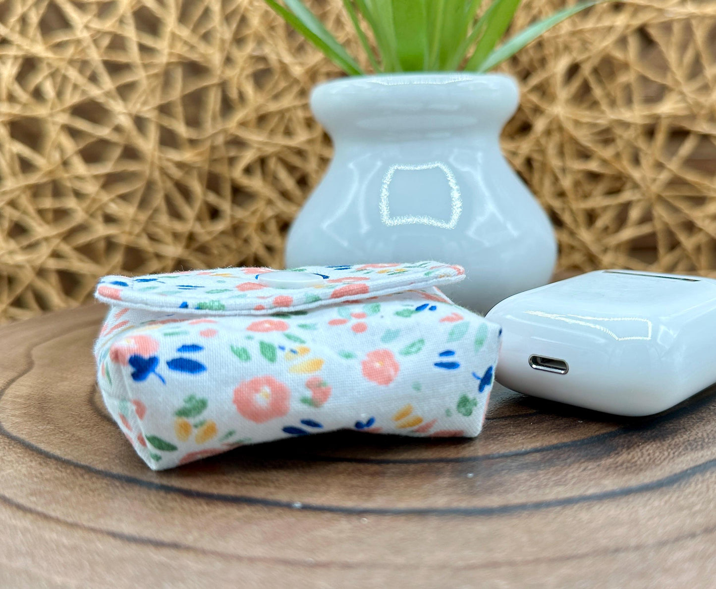 Wireless earbud case, Dainty Pink floral fabric With Blue Leaves; snap closure and swivel clasp for stylish convenience and security 3X3X.75