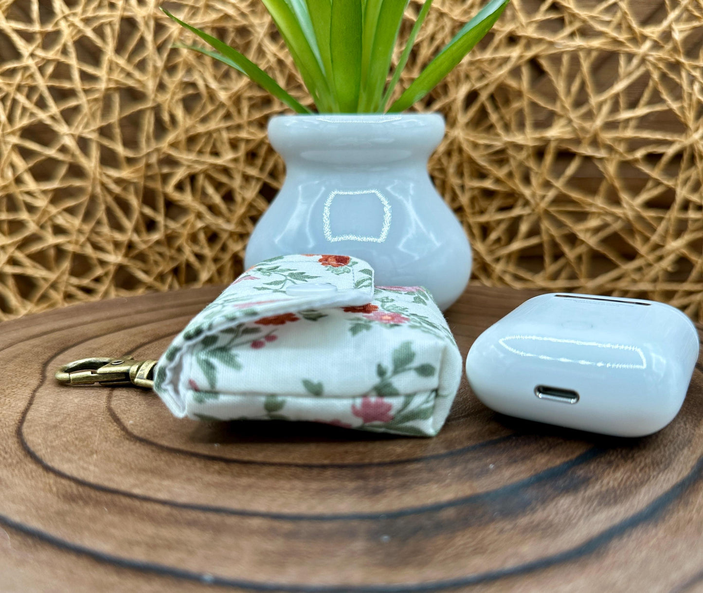 Wireless earbud case, Dainty Rust and Pink floral fabric with snap closure and swivel clasp for added protection and convenience, 3X3X.75"
