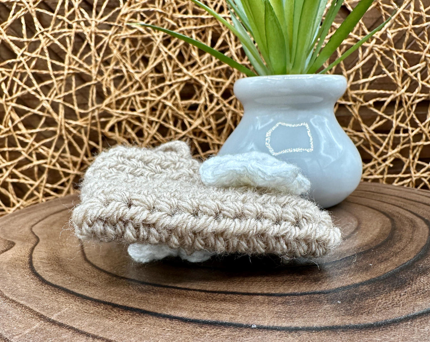 Beige Crocheted Wireless earbud case, compatible with AirPods, measures 3.25 W 2.75 H .5 D