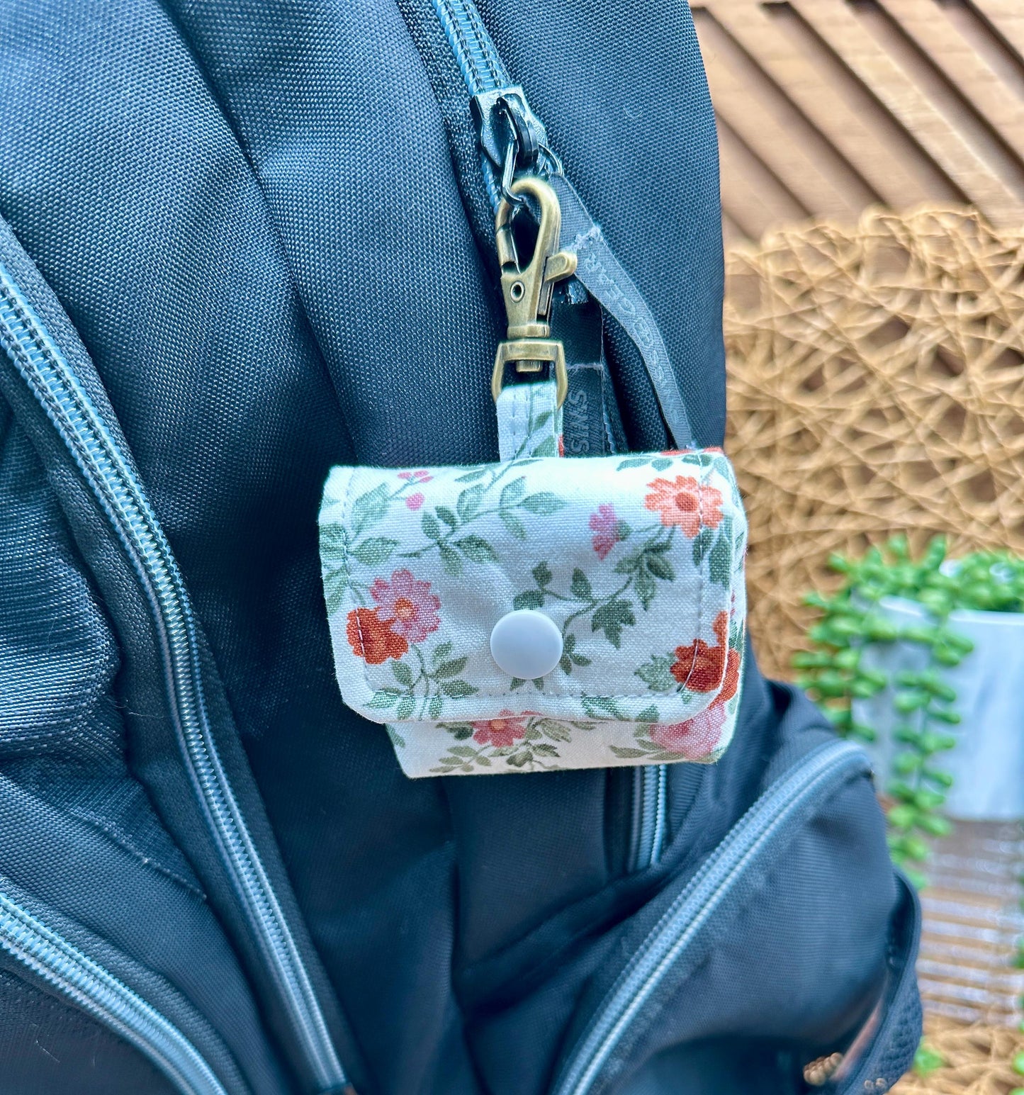 Wireless earbud case, Dainty Rust and Pink floral fabric with snap closure and swivel clasp for added protection and convenience, 3X3X.75"