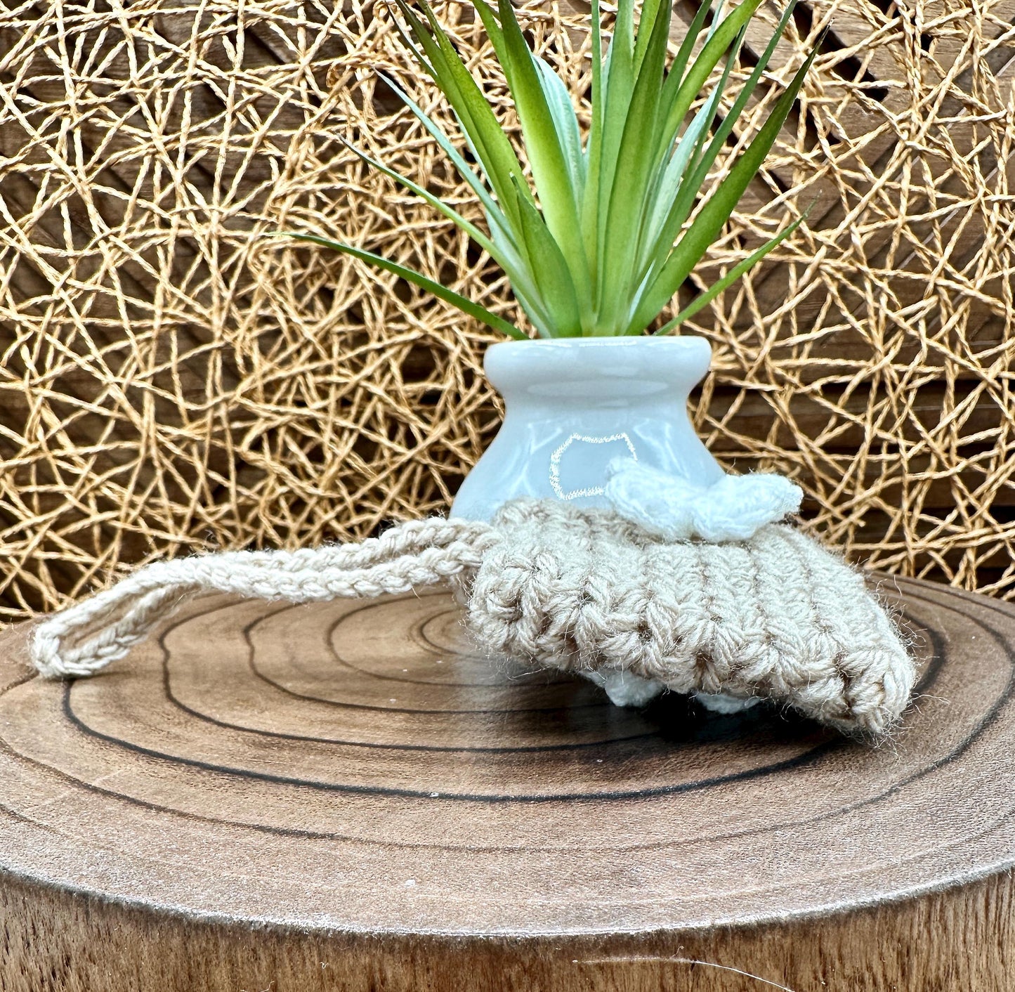 Beige Crocheted Wireless earbud case, compatible with AirPods, measures 3.25 W 2.75 H .5 D