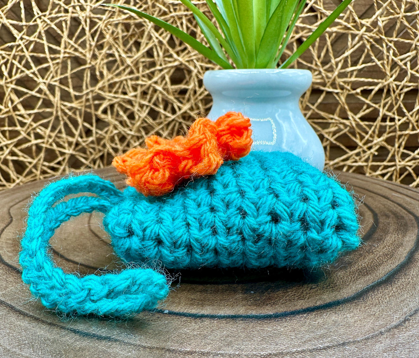 Blue Crocheted Wireless earbud case, compatible with AirPods, measures 3 T 3 H .25 D, Pretty Raised Orange Flower Granny Square Design