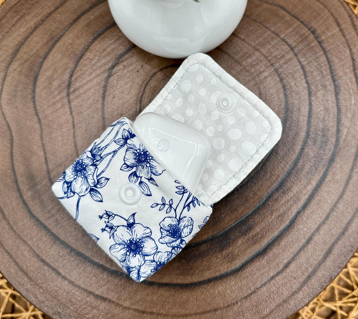 Wireless earbud case, Elegant Navy Floral fabric with snap closure and swivel clasp for added protection and convenience, 3X3X.75"