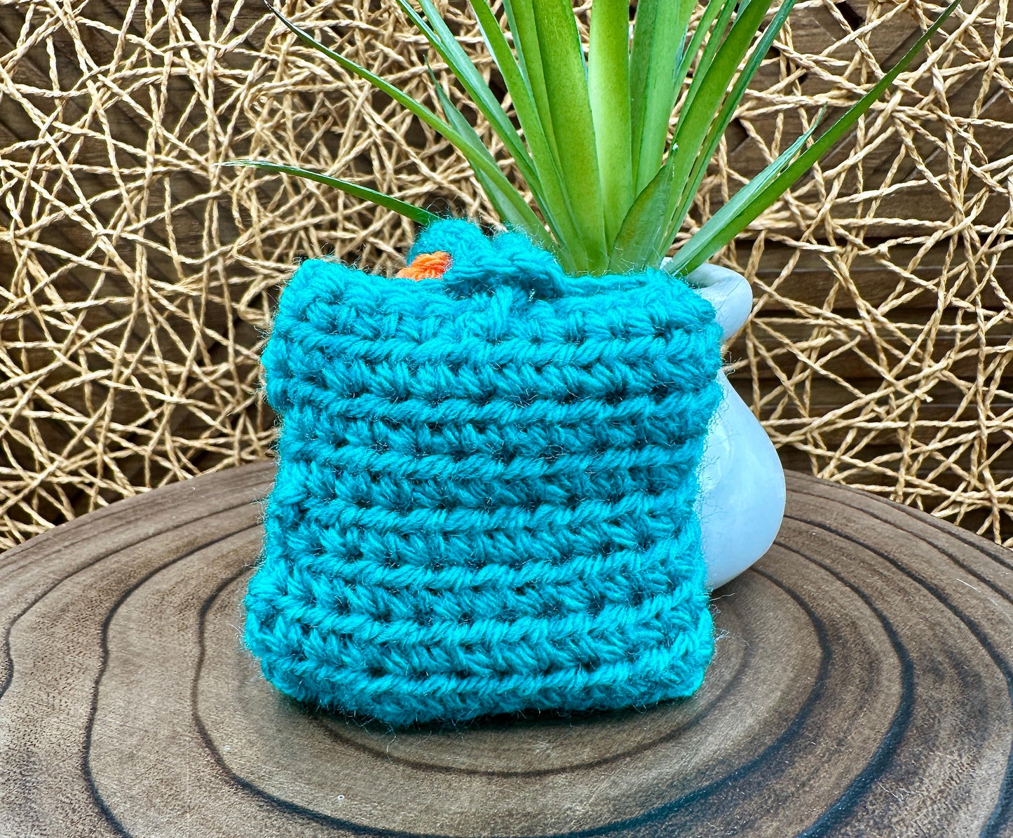 Blue Crocheted Wireless earbud case, compatible with AirPods, measures 3 T 3 H .25 D, Pretty Raised Orange Flower Granny Square Design