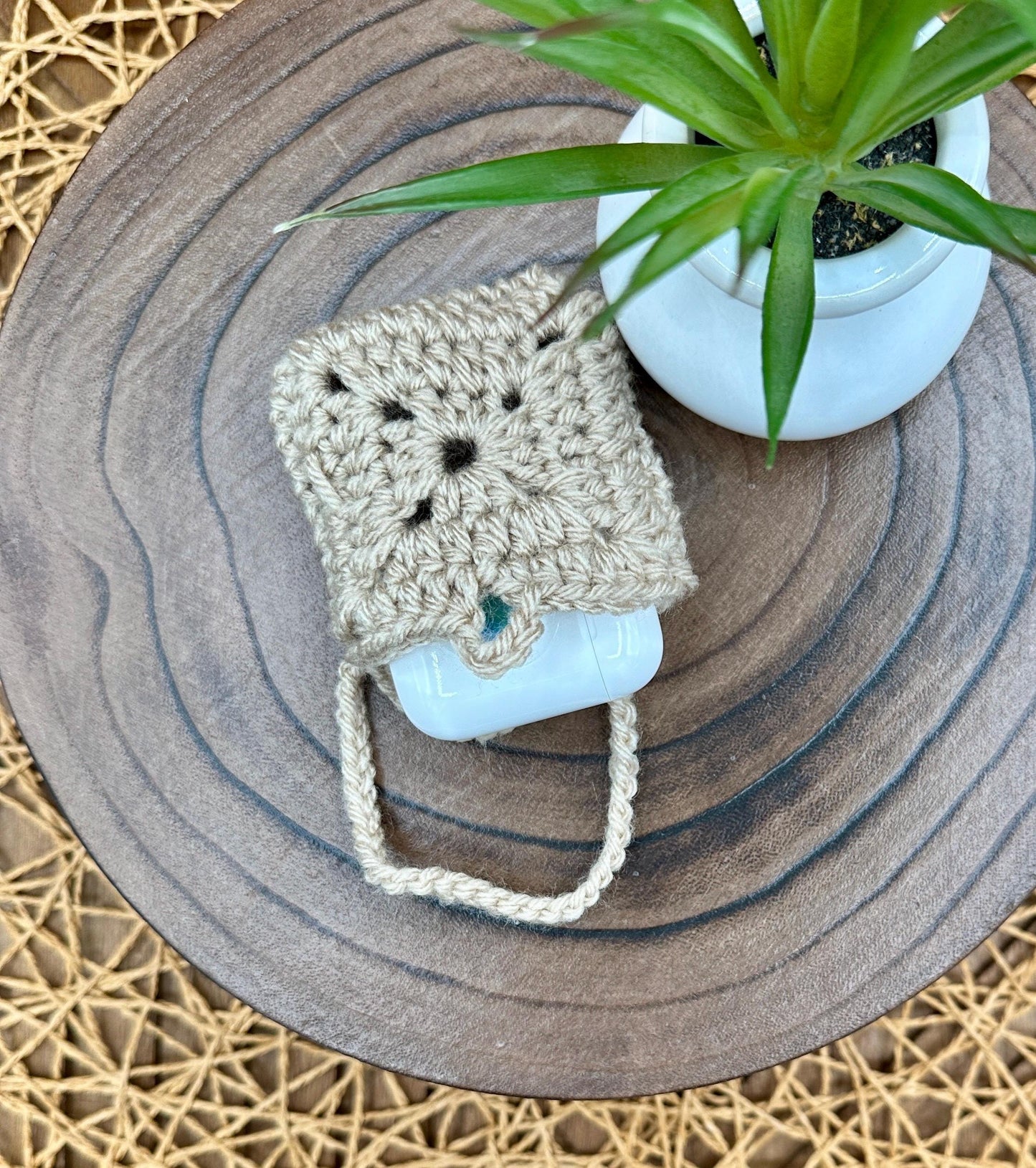 Beige Crocheted Wireless earbud case, compatible with AirPods, measures 3 T 3 H .25 D, Granny Square Design