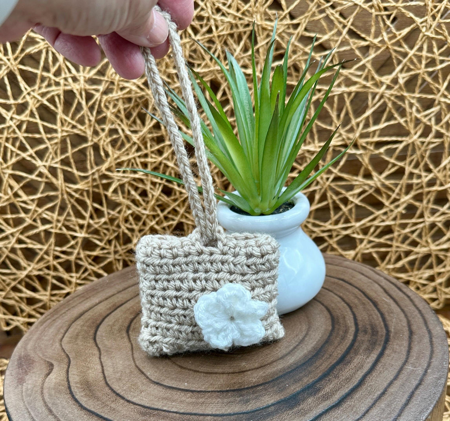 Beige Crocheted Wireless earbud case, compatible with AirPods, measures 3.25 W 2.75 H .5 D