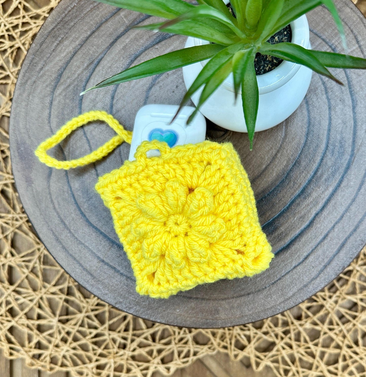 Yellow Crocheted Wireless earbud case, compatible with AirPods, measures 3 T 3 H .25 D, Pretty Raised Flower Granny Square Design