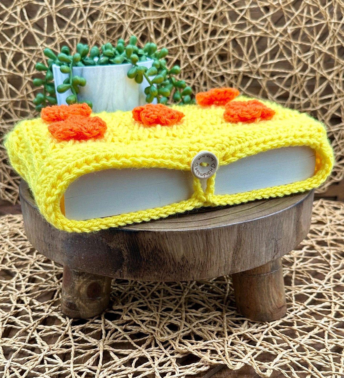 Flower Power Book Sleeve, Soft Crochet in Yellow Yarn with Orange Flowers, Secure Wood Button Closure Measures about 10 X6 "