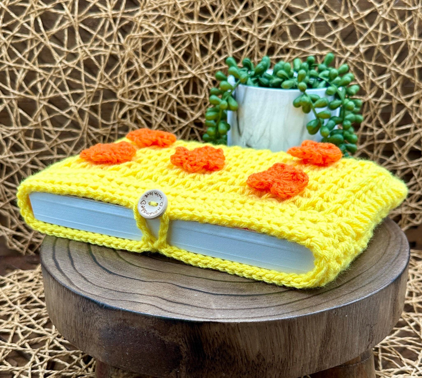Flower Power Book Sleeve, Soft Crochet in Yellow Yarn with Orange Flowers, Secure Wood Button Closure Measures about 10 X6 "