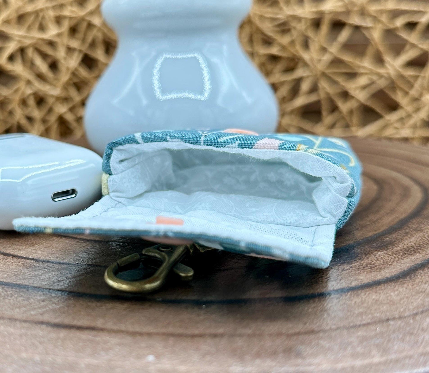 Wireless earbud case, Boho Green Floral fabric with snap closure and swivel clasp for protection and convenience, 3X3X.75"