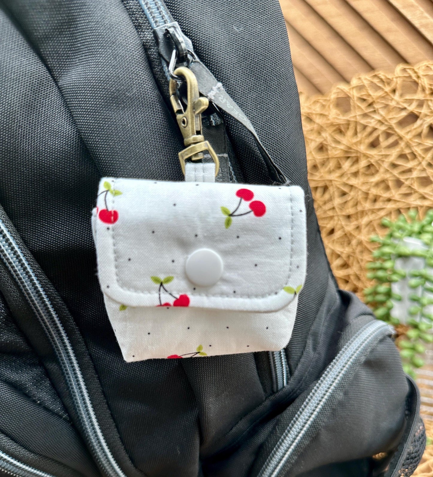 Wireless earbud case, Red Cherry Print Fabric with snap closure and swivel clasp for added protection and convenience, 3X3X.75"