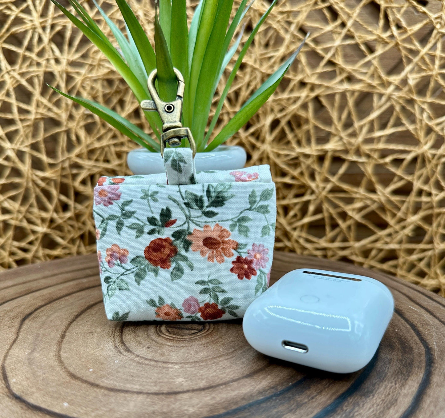Wireless earbud case, Dainty Rust and Pink floral fabric with snap closure and swivel clasp for added protection and convenience, 3X3X.75"