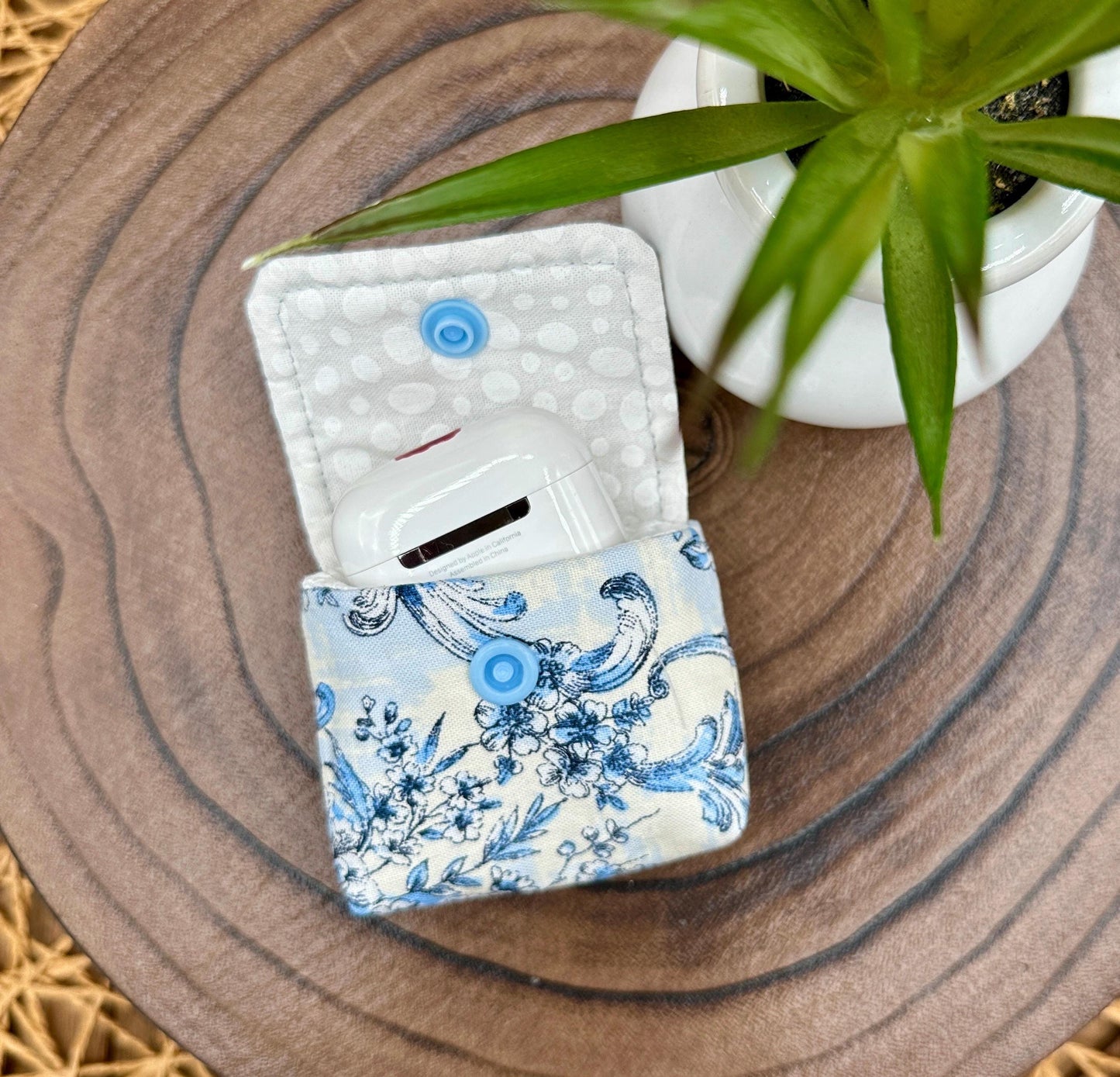 Wireless earbud case, elegant blue floral fabric with snap closure and swivel clasp for added protection and convenience, 3X3X.75"