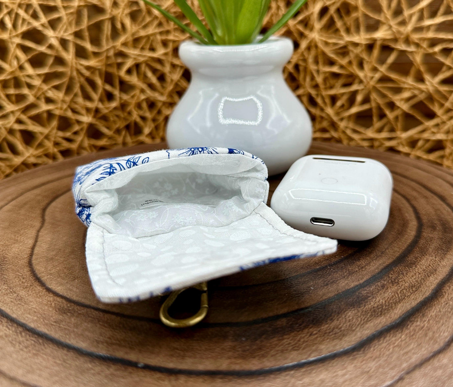Wireless earbud case, Elegant Navy Floral fabric with snap closure and swivel clasp for added protection and convenience, 3X3X.75"