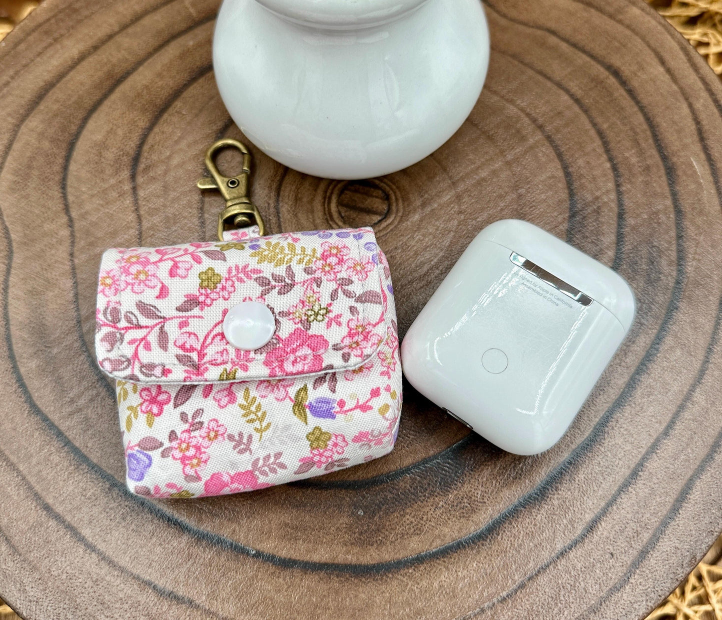 Wireless earbud case, Dainty Lilac and Pink floral fabric with snap closure and swivel clasp for added protection and convenience, 3X3X.75"