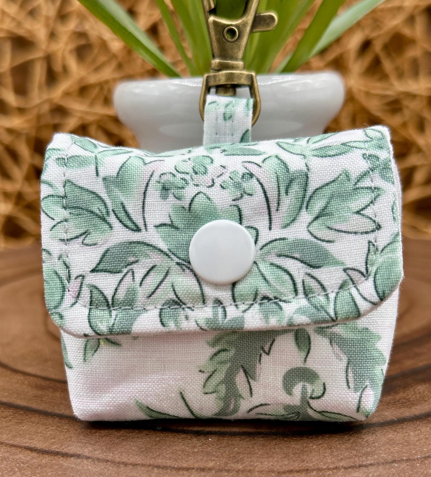 Wireless earbud case, Elegant Green Floral fabric with snap closure and swivel clasp for protection and convenience, 3X3X.75"