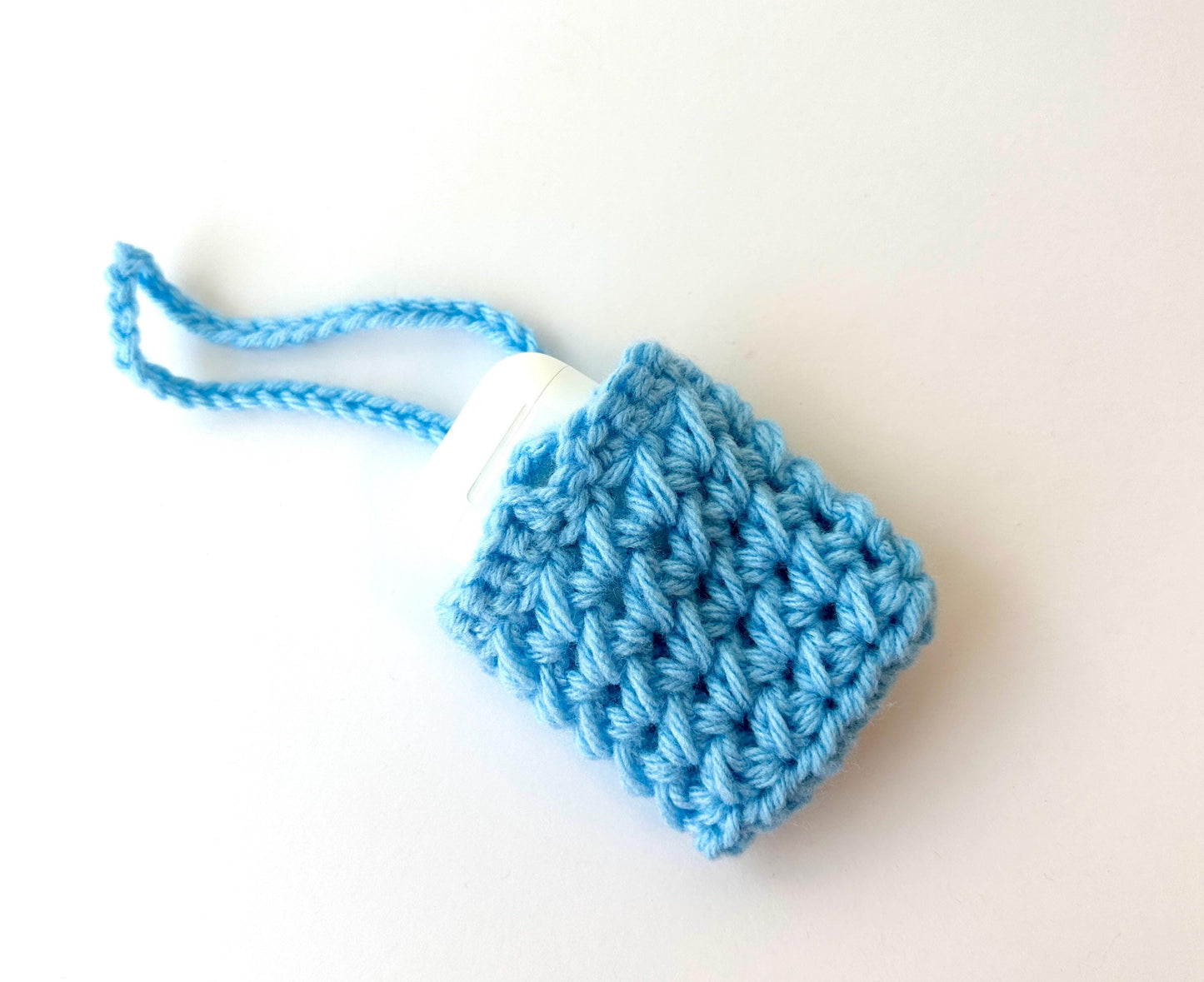 Blue Crocheted Wireless earbud case, compatible with AirPods, measures 3 T 3 H .25 D, Pretty Crochet Stitch Design