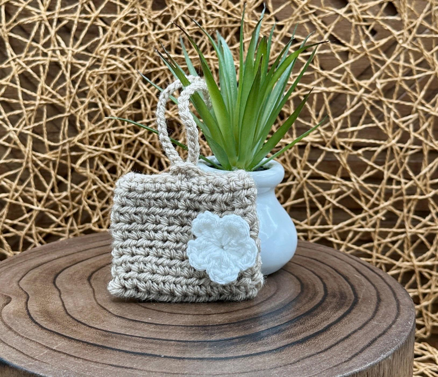 Beige Crocheted Wireless earbud case, compatible with AirPods, measures 3.25 W 2.75 H .5 D