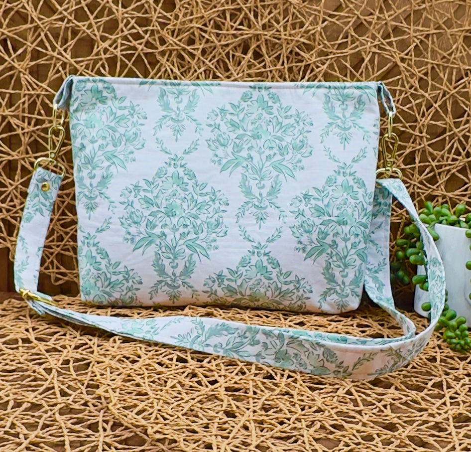Green floral print east west everyday crossbody bag with adjustable and removable strap, gold hardware