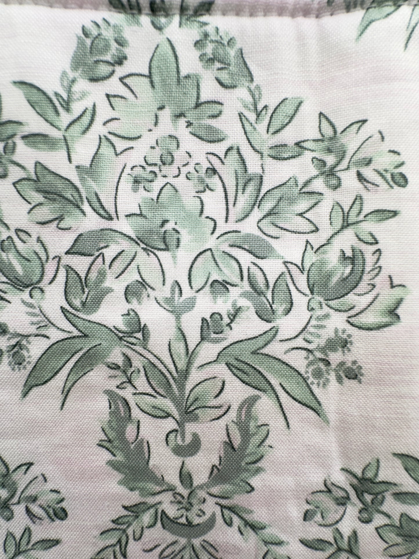close up of green cotton floral fabric