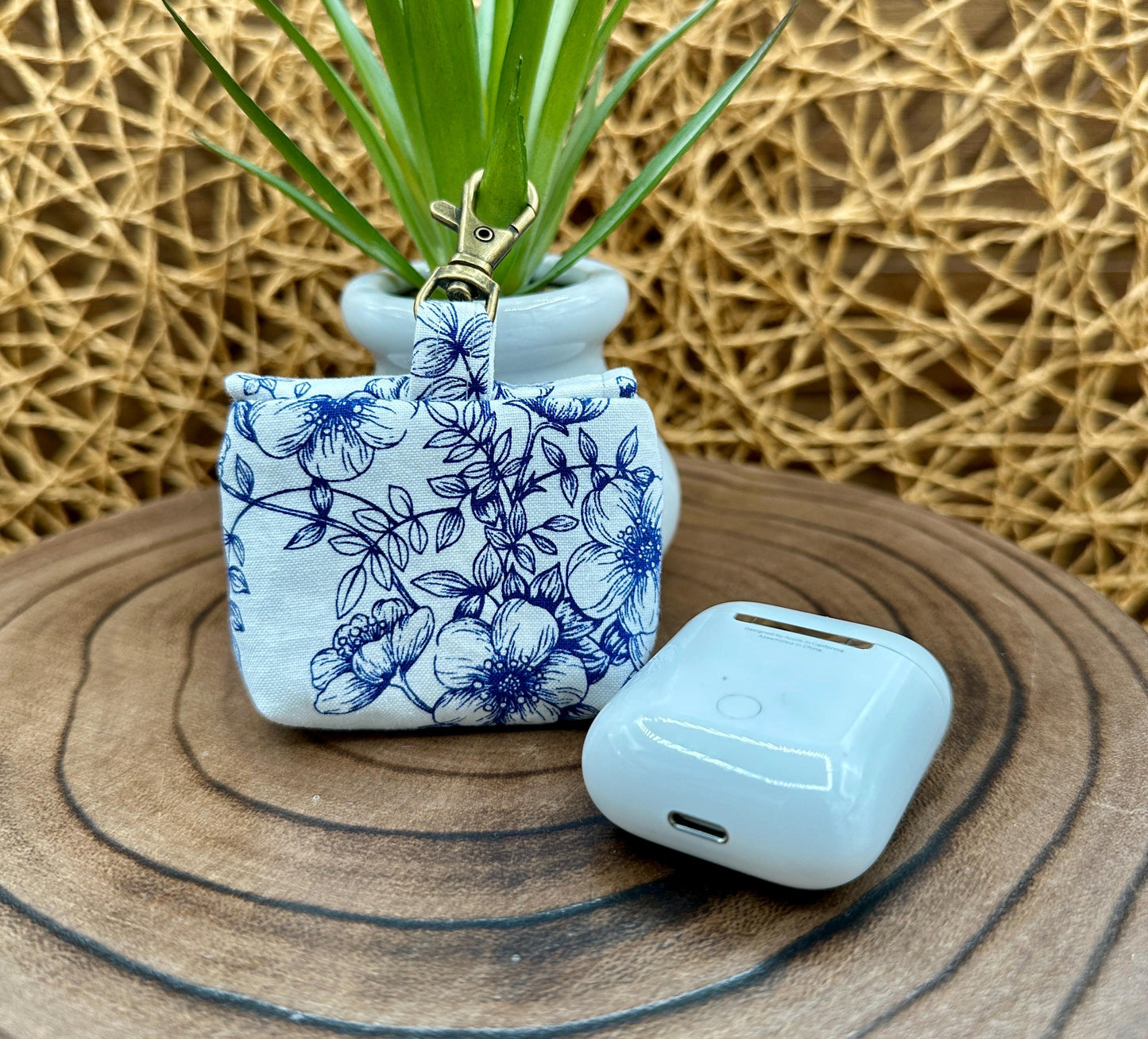 Wireless earbud case, Elegant Navy Floral fabric with snap closure and swivel clasp for added protection and convenience, 3X3X.75"