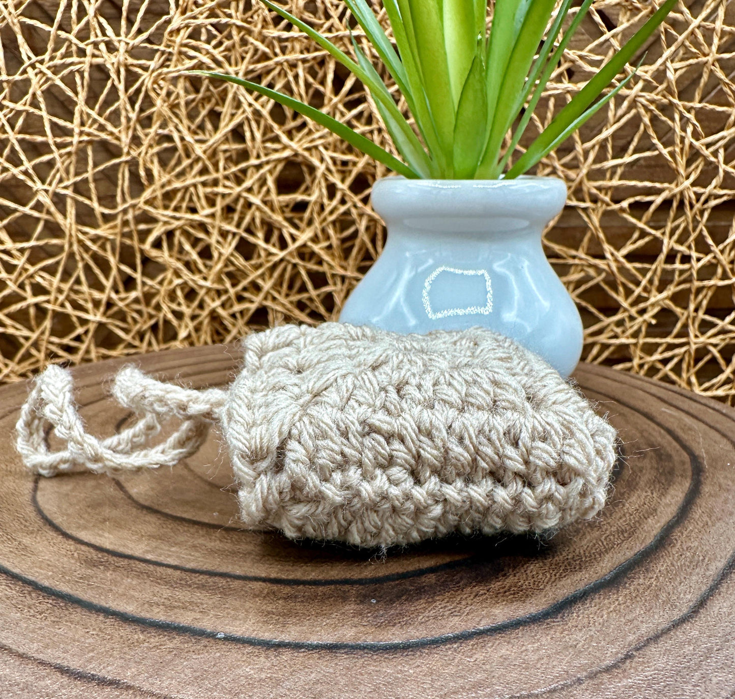 Beige Crocheted Wireless earbud case, compatible with AirPods, measures 3 T 3 H .25 D, Granny Square Design