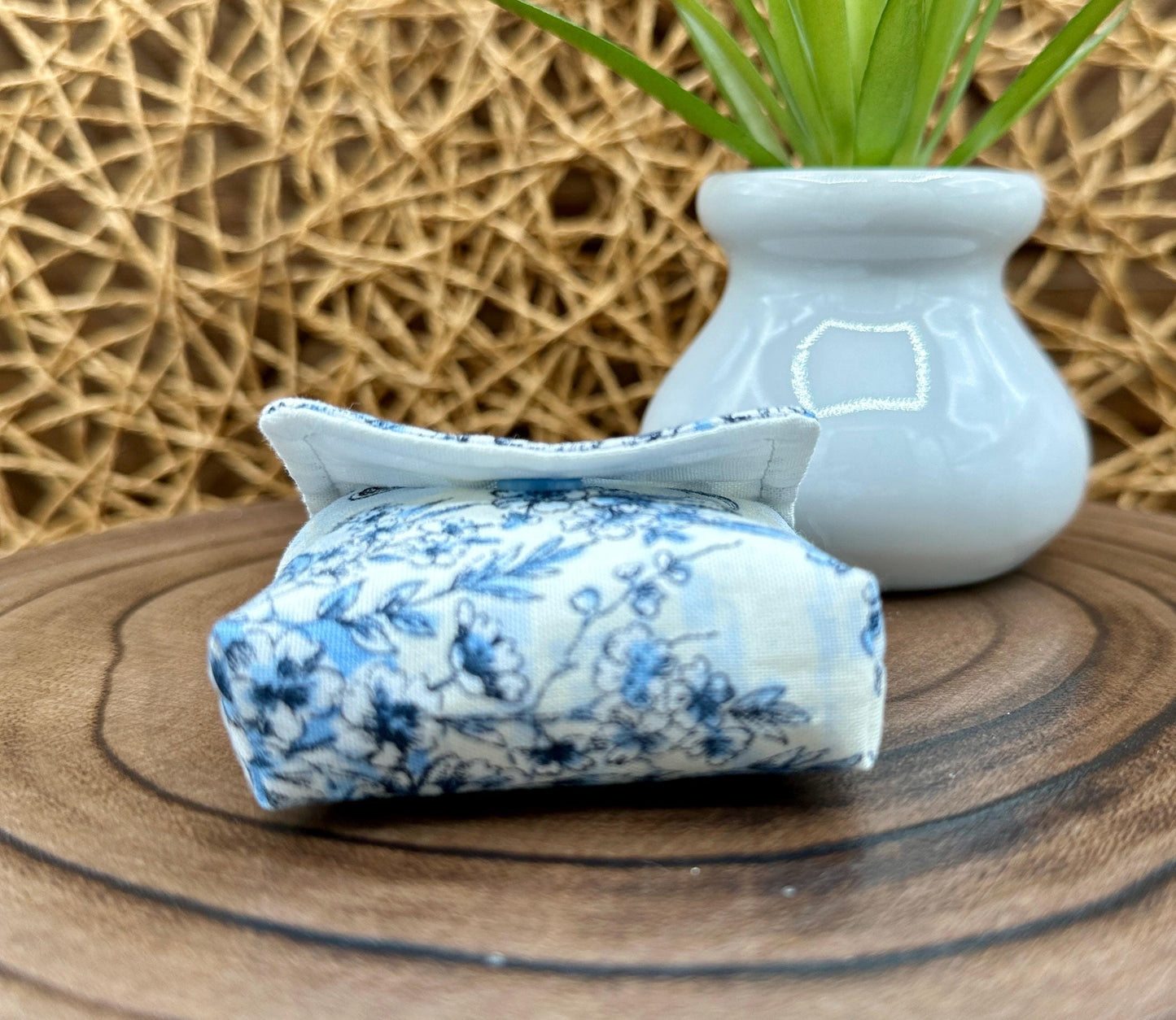 Wireless earbud case, elegant blue floral fabric with snap closure and swivel clasp for added protection and convenience, 3X3X.75"