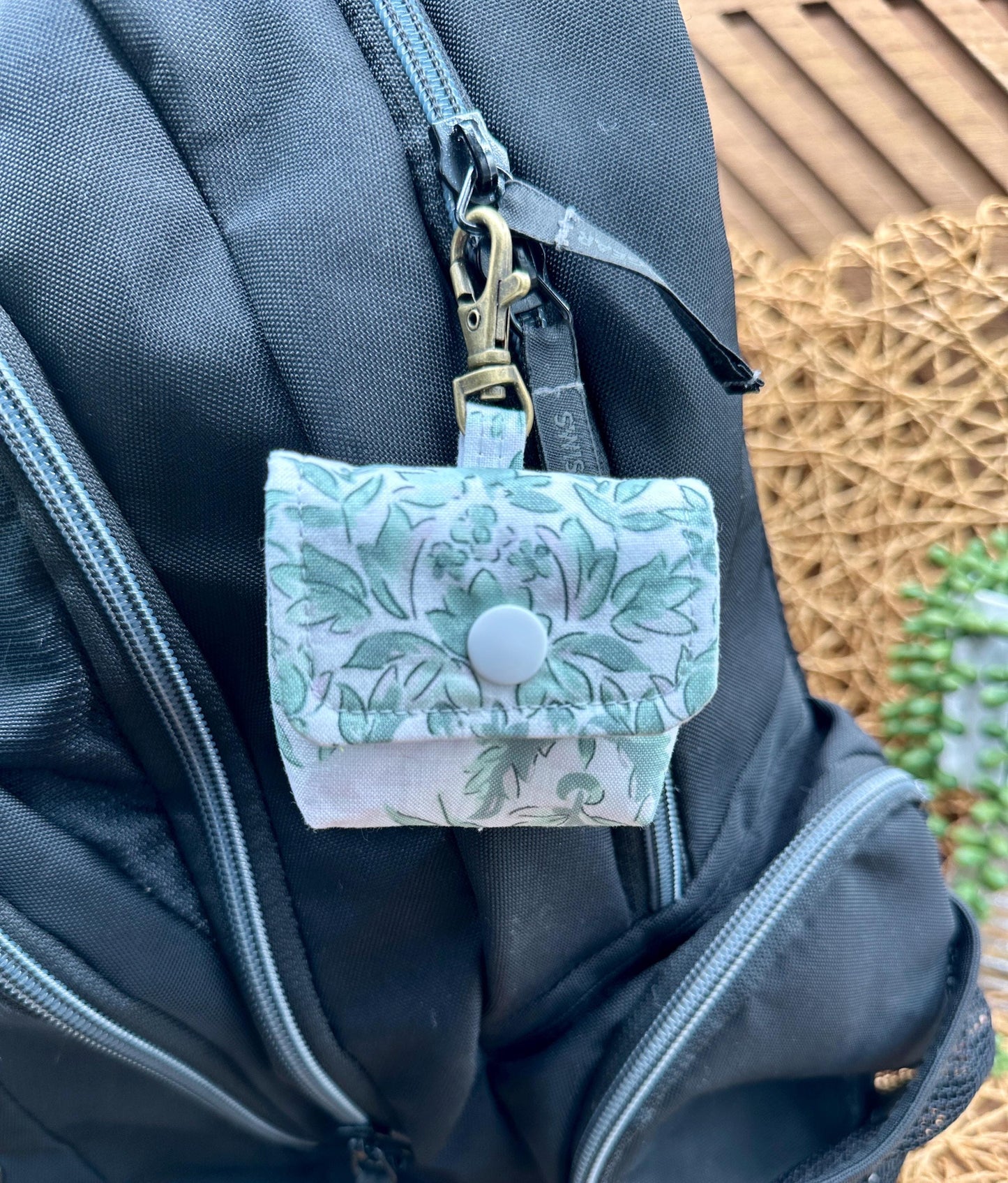 Wireless earbud case, Elegant Green Floral fabric with snap closure and swivel clasp for protection and convenience, 3X3X.75"