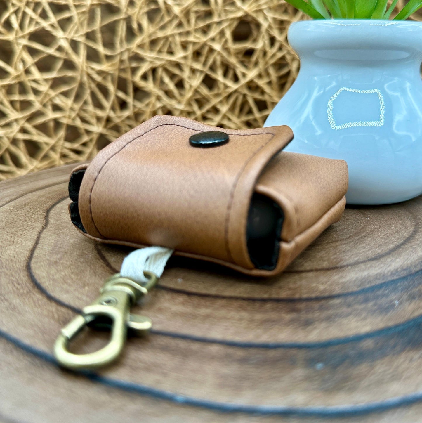 Brown Faux Leather Wireless earbud case, compatible with AirPods, snap closure swivel clasp included for easy and secure carry, 3X3X.75"