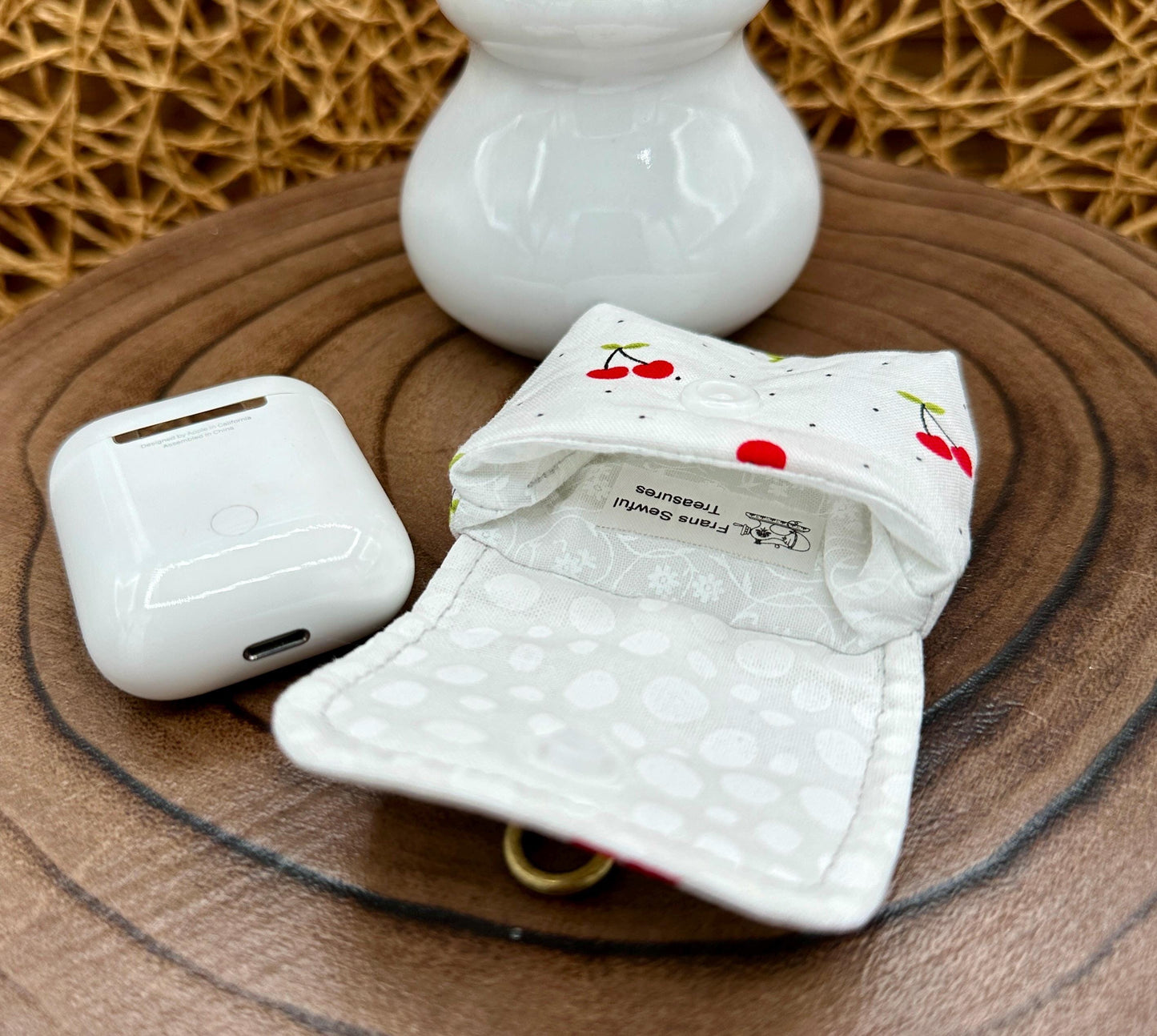 Wireless earbud case, Red Cherry Print Fabric with snap closure and swivel clasp for added protection and convenience, 3X3X.75"