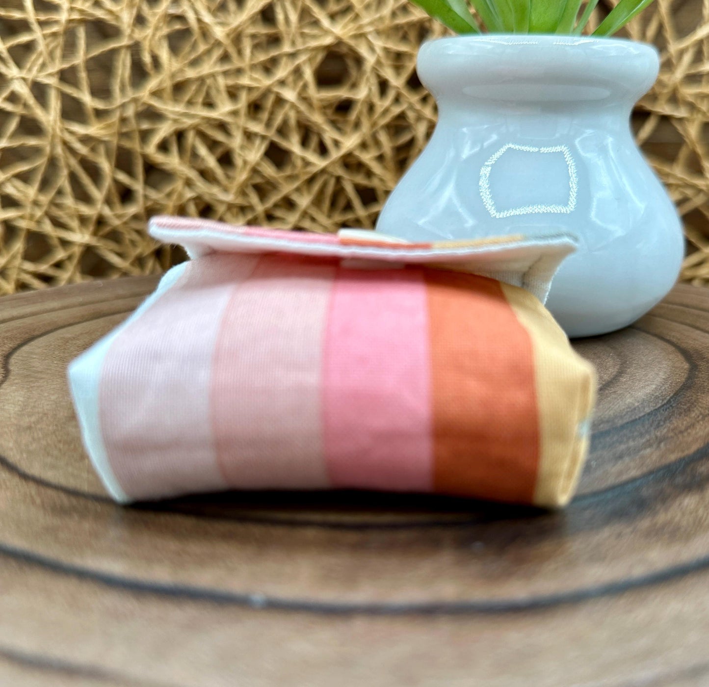 Wireless earbud case, pastel striped fabric with snap closure and swivel clasp for added protection and convenience, 3X3X.75"