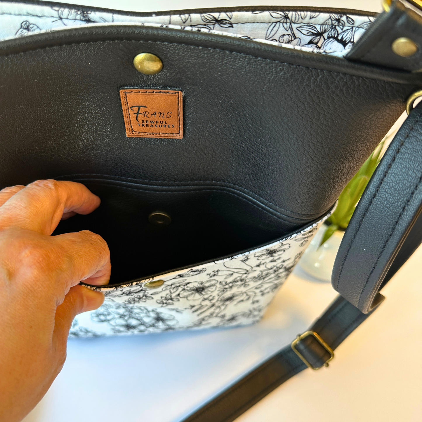 Black Floral Faux Leather Crossbody Bag with Adjustable Strap and Magnetic Snap Closure