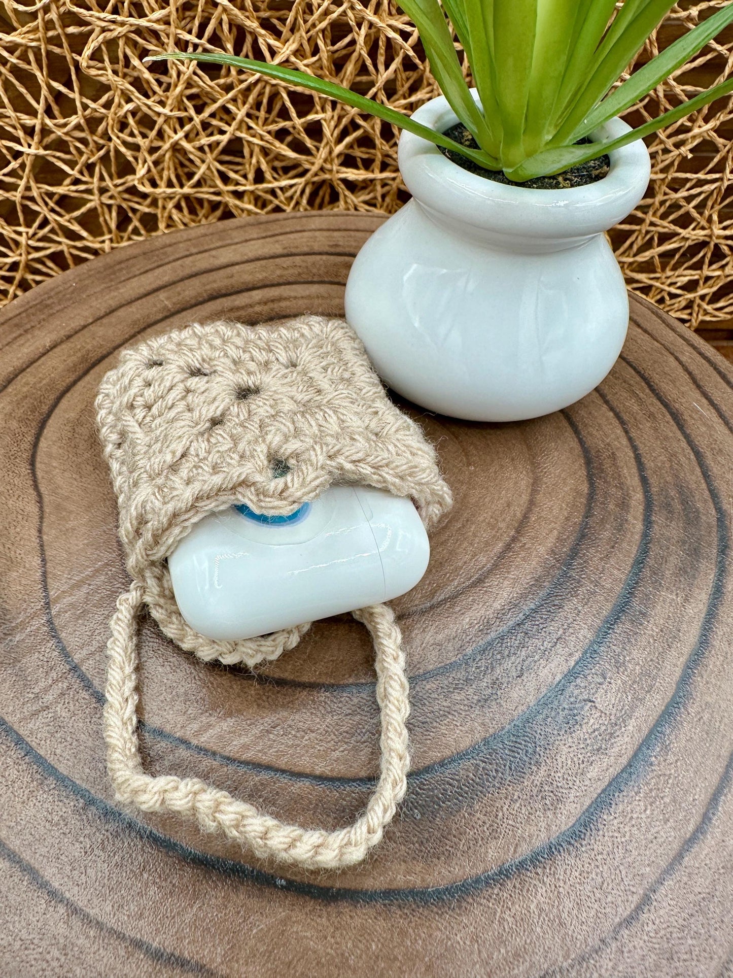 Beige Crocheted Wireless earbud case, compatible with AirPods, measures 3 T 3 H .25 D, Granny Square Design