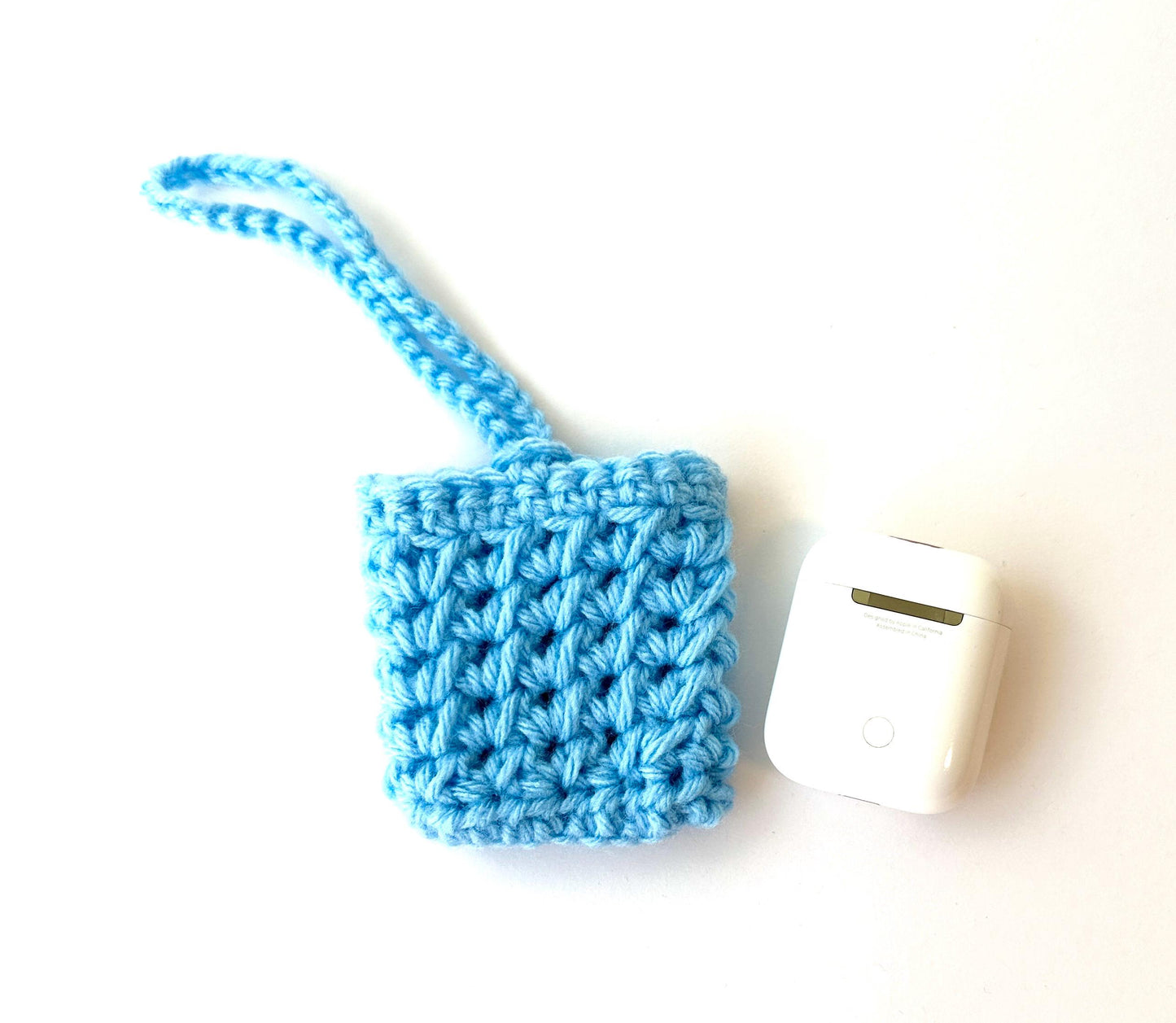 Blue Crocheted Wireless earbud case, compatible with AirPods, measures 3 T 3 H .25 D, Pretty Crochet Stitch Design