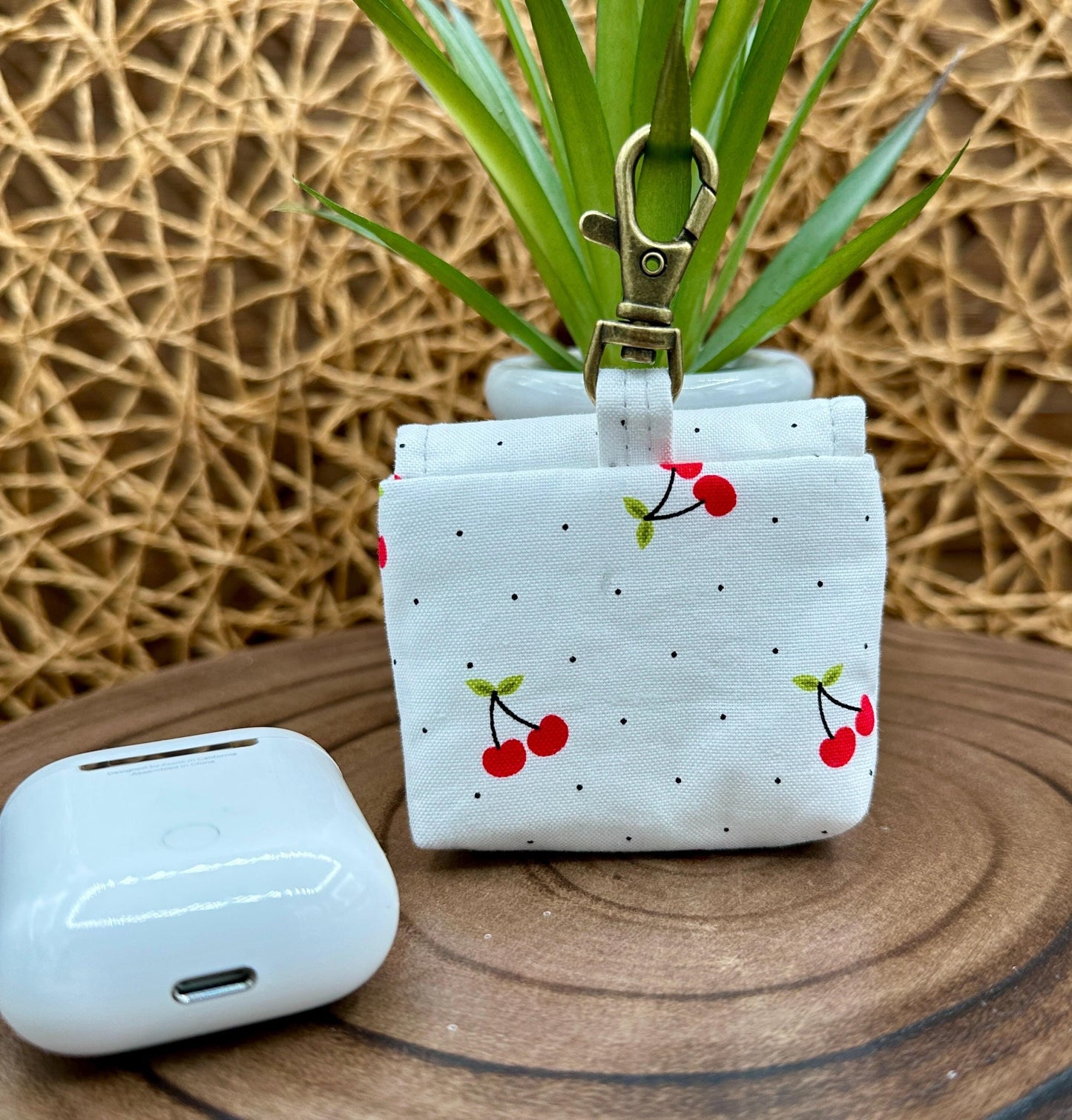 Wireless earbud case, Red Cherry Print Fabric with snap closure and swivel clasp for added protection and convenience, 3X3X.75"