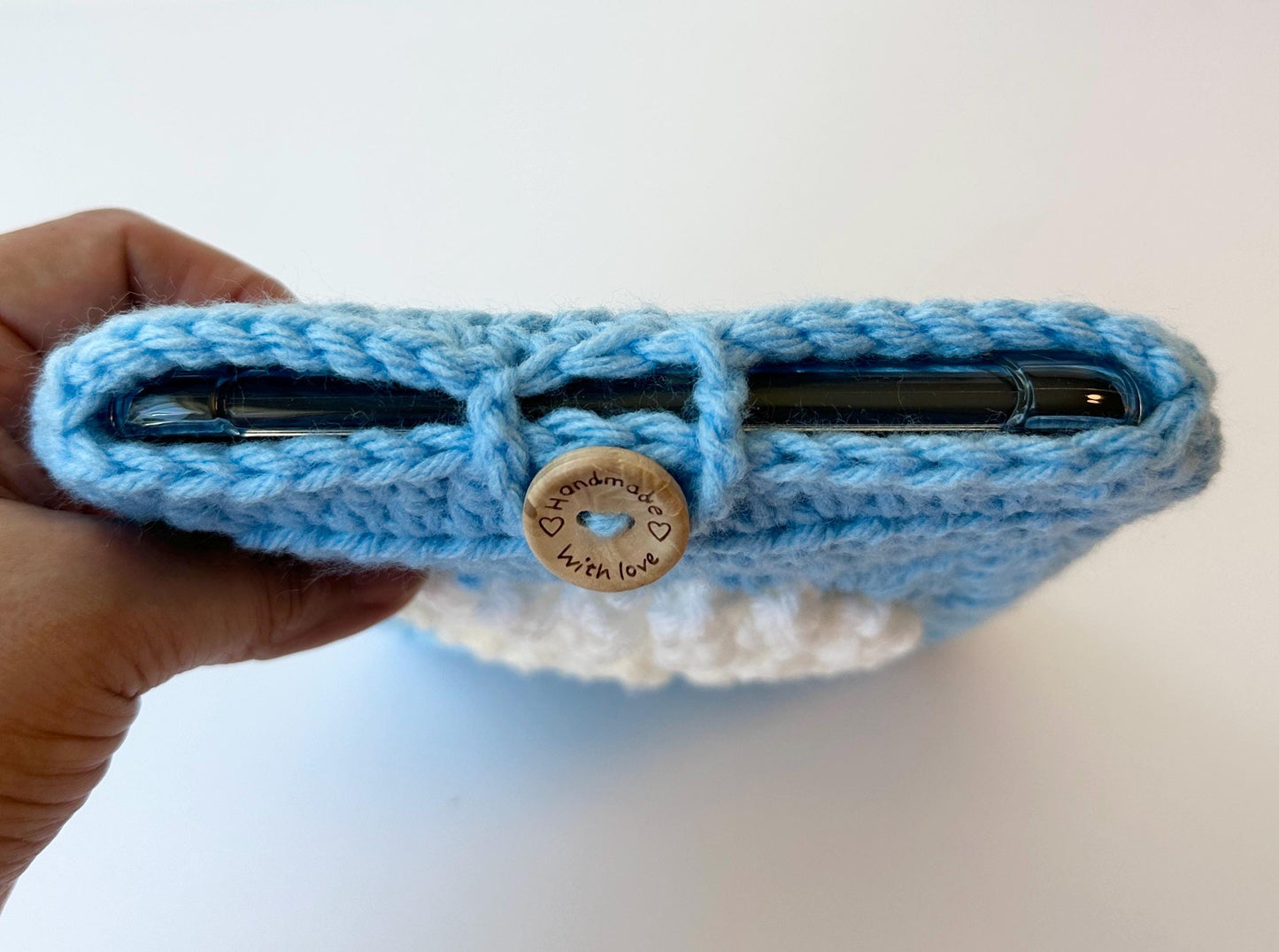 Blue Crocheted Kindle Sleeve with White Flower Granny Square & Wood Button, Handmade E-Reader Cover, Gift for Book Lovers measures 7.5 X 5.5