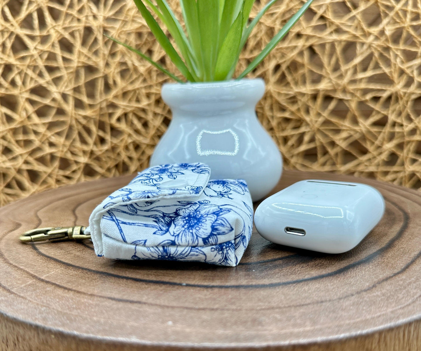 Wireless earbud case, Elegant Navy Floral fabric with snap closure and swivel clasp for added protection and convenience, 3X3X.75"