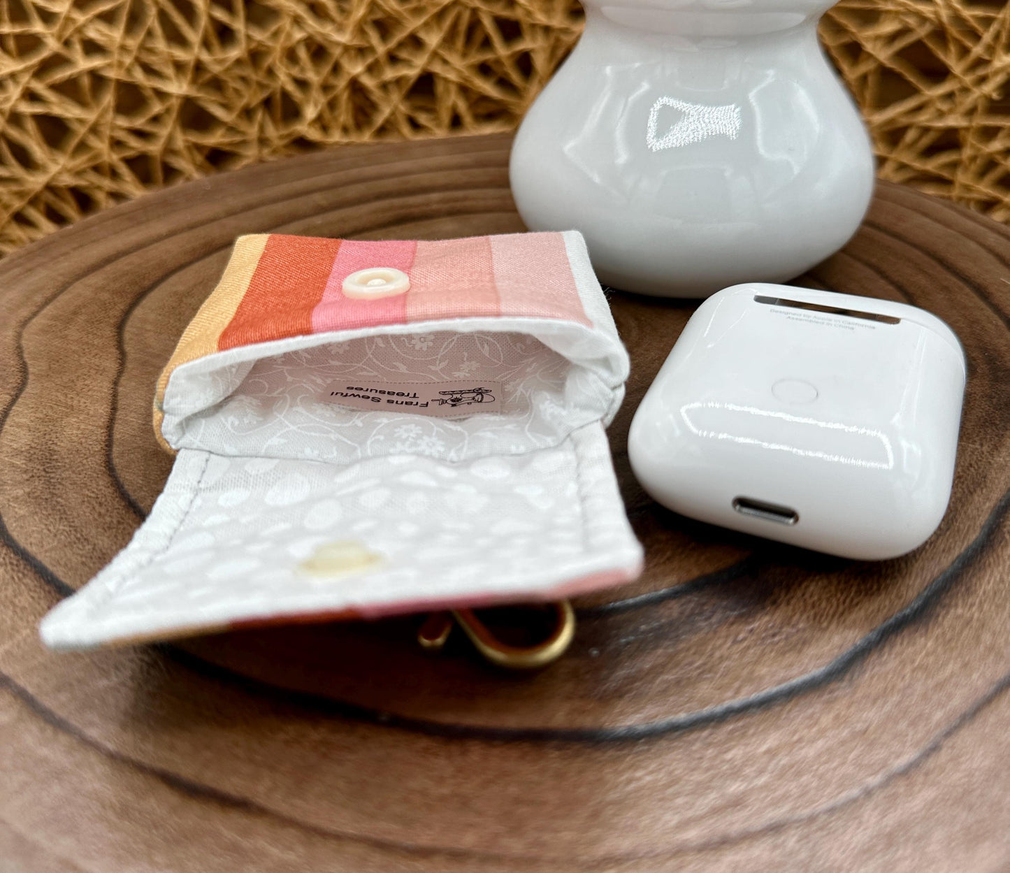 Wireless earbud case, pastel striped fabric with snap closure and swivel clasp for added protection and convenience, 3X3X.75"