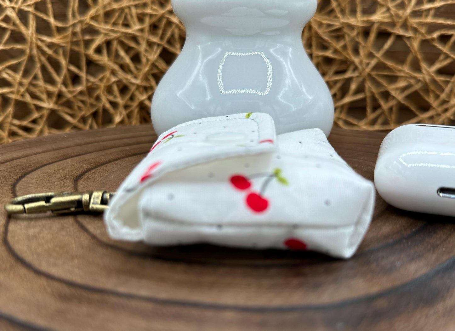 Wireless earbud case, Red Cherry Print Fabric with snap closure and swivel clasp for added protection and convenience, 3X3X.75"