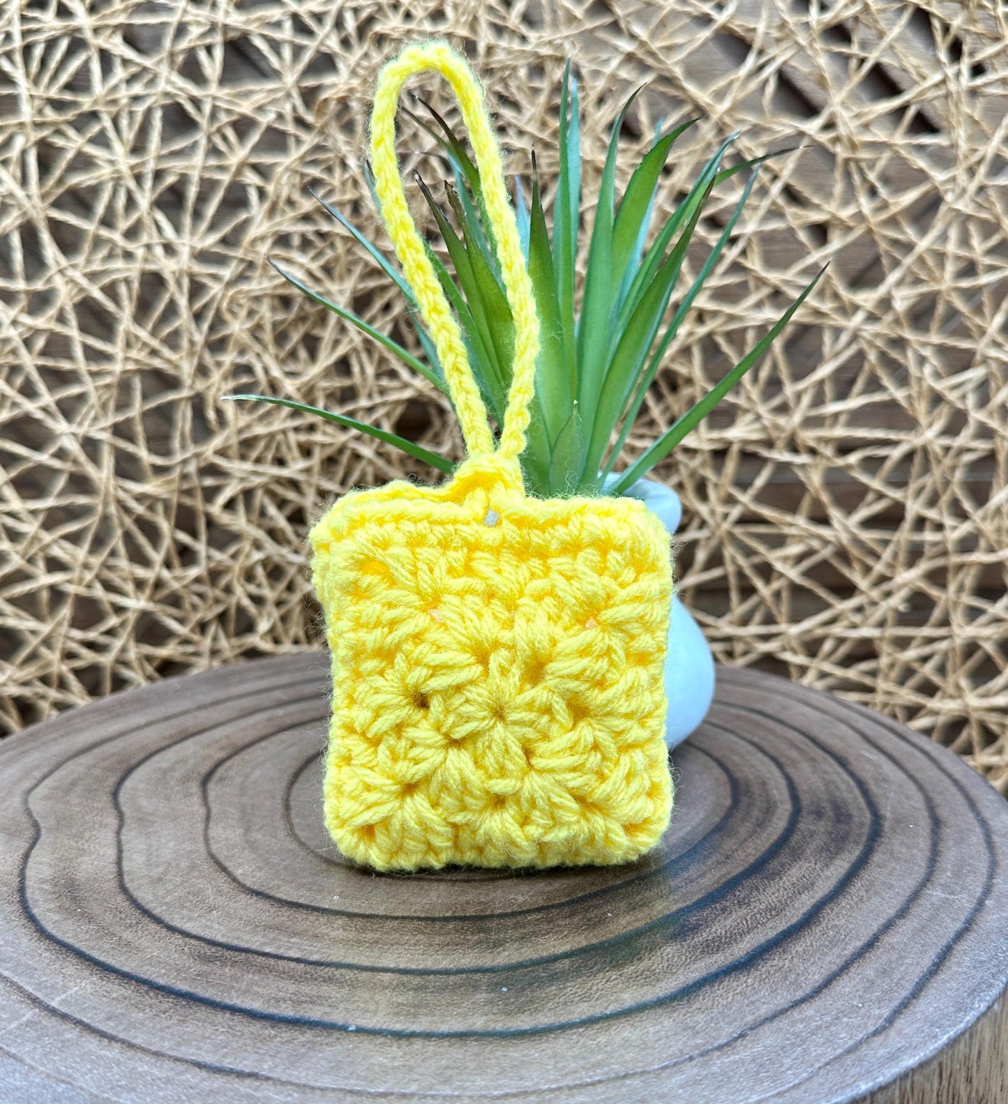Yellow Crocheted Wireless earbud case, compatible with AirPods, measures 3 T 3 H .25 D, Pretty Granny Square Design