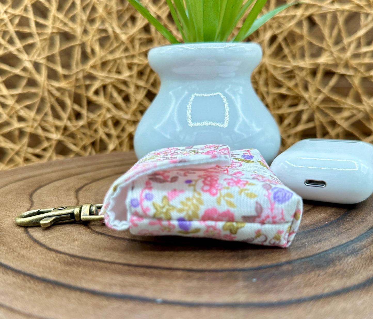Wireless earbud case, Dainty Lilac and Pink floral fabric with snap closure and swivel clasp for added protection and convenience, 3X3X.75"